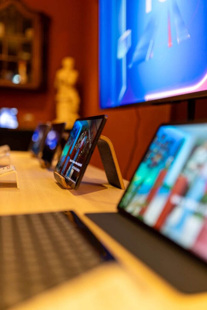 tablets standing on display in a store with electronics